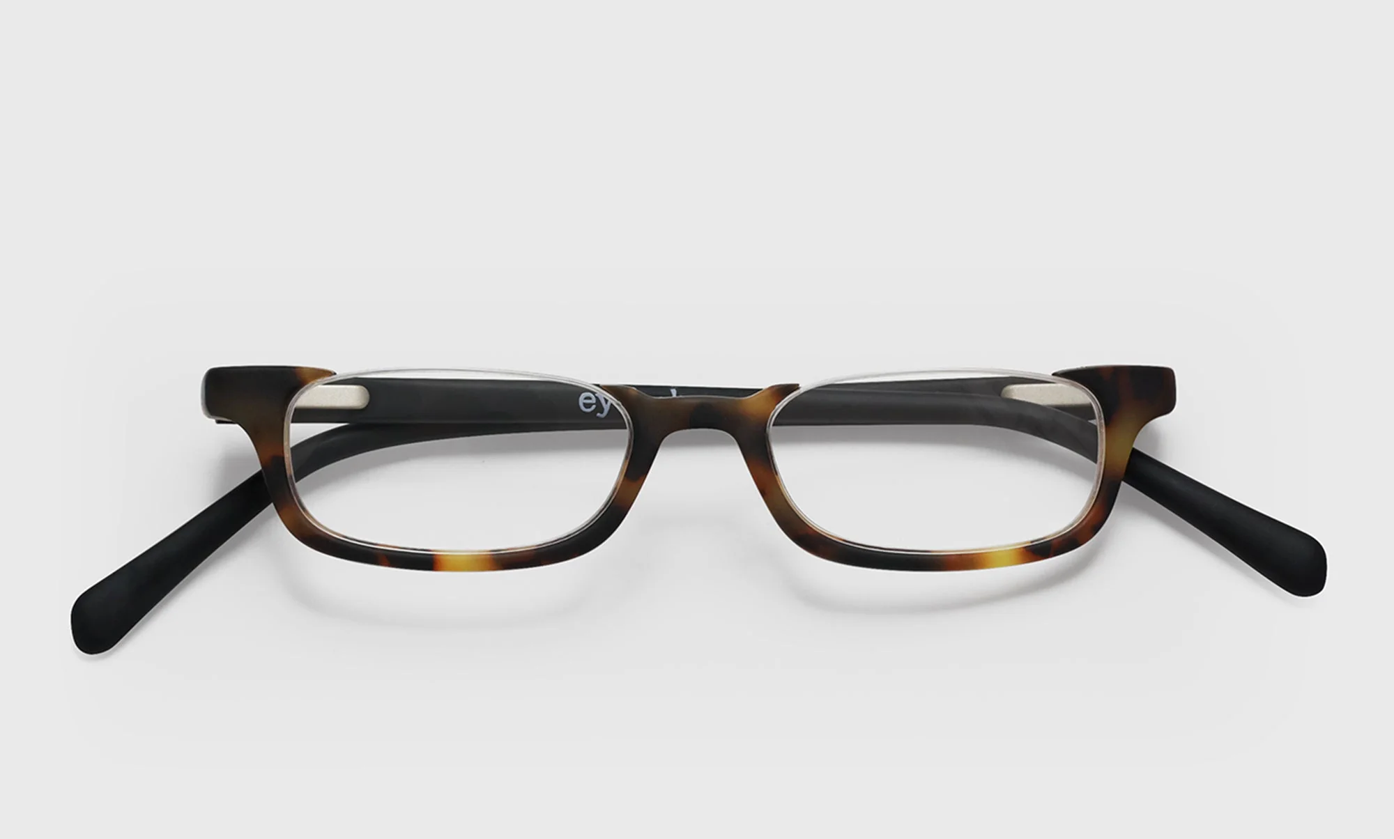 What Inheritance? Color 18 - Tortoise Front with Black Temples in a Matte Finish - Image 3