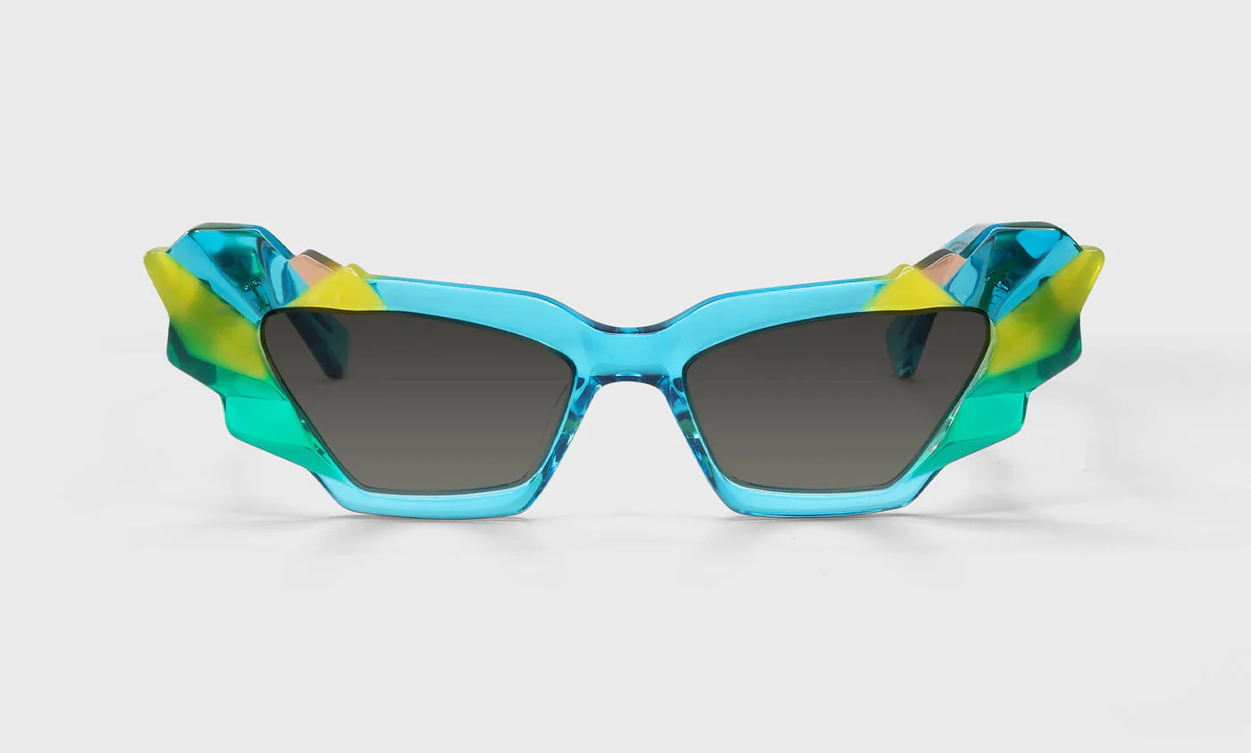 Eye of the Beholder Color 10 - Bursts of Teal, Yellow, and Green Trapezoids with Hits of Orange on the Temples
